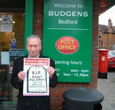 Cllr David Sawyer outside Kimbolton Road Post Office