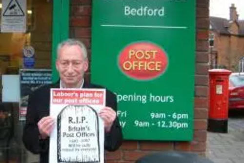 Cllr David Sawyer outside Kimbolton Road Post Office