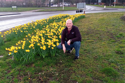 Cllr Dean Crofts with daffodils planted thanks to Cllr Crofts’s and Councillor Solomons’s ward-funded planting in Kingsbrook