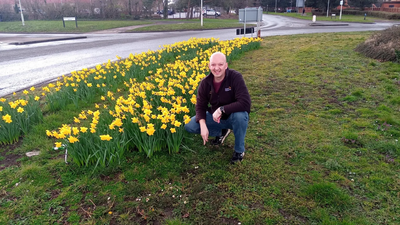 Cllr Dean Crofts with daffodils planted thanks to Cllr Crofts’s and Councillor Solomons’s ward-funded planting in Kingsbrook