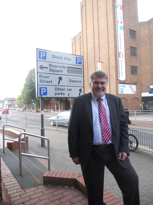 Mayor Dave Hodgson with the car parks sign on Horne Lane, Bedford