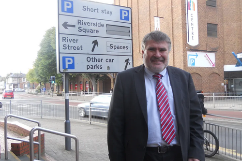 Mayor Dave Hodgson with the car parks sign on Horne Lane, Bedford