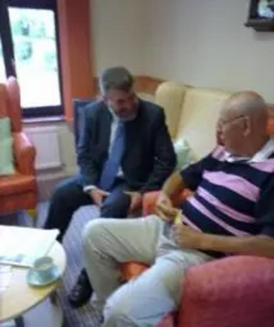 Dave Hodgson chatting to a resident at Maydenbury House