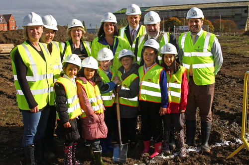 Dave Hodgson with children from Shortstown Lower School and Others Assembled for the turning of the first sod at the site of the new Shortstown Primary School