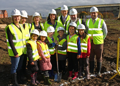 Dave Hodgson with children from Shortstown Lower School and Others Assembled for the turning of the first sod at the site of the new Shortstown Primary School