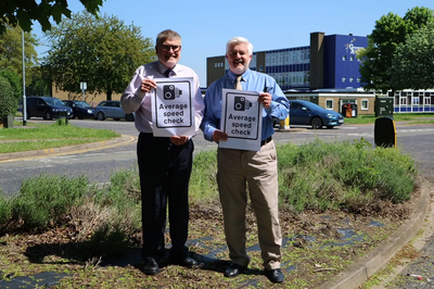 Mayor Dave Hodgson and Cllr Charles Royden with Average Speed Camera Signs