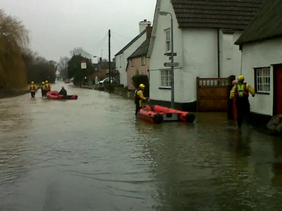 Members of the Fire and Rescue Service Come to the Aid of Flood-Hit Properties in Riseley