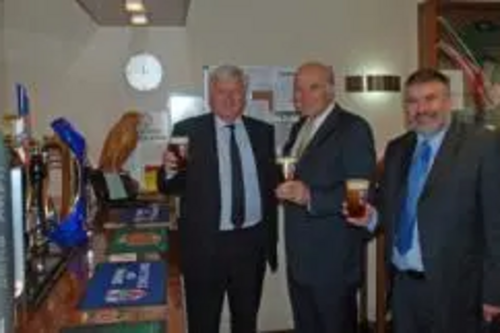 Tom Wells, Vince Cable and Dave Hodgson having a half pint at the Wells and Youngs brewery in Queens Park