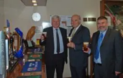 Tom Wells, Vince Cable and Dave Hodgson having a half pint at the Wells and Youngs brewery in Queens Park