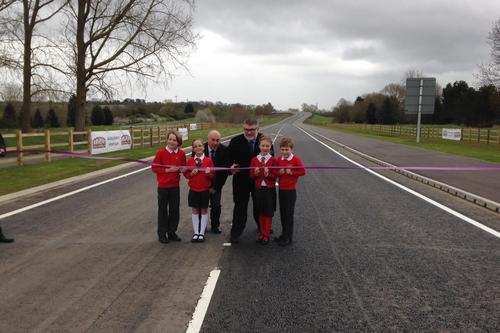 Mayor Dave Hodgson, John Breheny and Children from St James School in Biddenham mark the opening of the final section of the Bedford Western Bypass