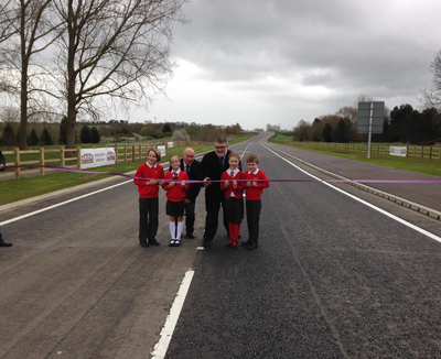 Mayor Dave Hodgson, John Breheny and Children from St James School in Biddenham mark the opening of the final section of the Bedford Western Bypass