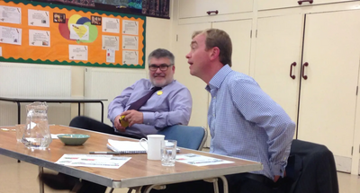 Tim Farron speaks to Liberal Democrat party members in Bedford, as Dave Hodgson looks on