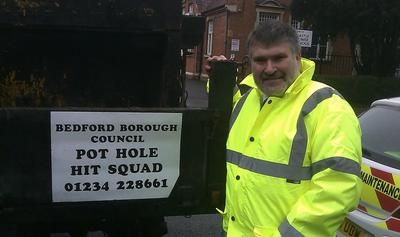 Dave Hodgson with Pothole Hit Squad Sign