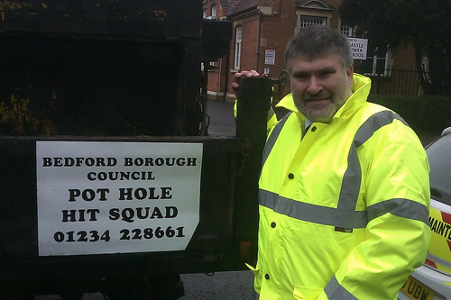 Dave Hodgson with Pothole Hit Squad Sign