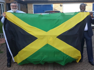 Mayor Dave Hodgson and Councillor Patrick Solomon with the Jamaican Flag