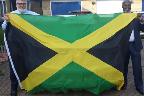 Mayor Dave Hodgson and Councillor Patrick Solomon with the Jamaican Flag