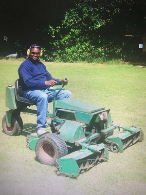 Cllr Patrick Solomon on a ride-on lawnmower