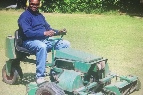 Cllr Patrick Solomon on a ride-on lawnmower