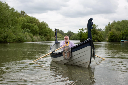 Mayor Dave Hodgson on a Viiking boat on Longholme Lake