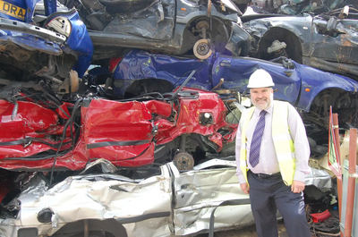 Mayor Dave Hodgson with crushed abandoned cars