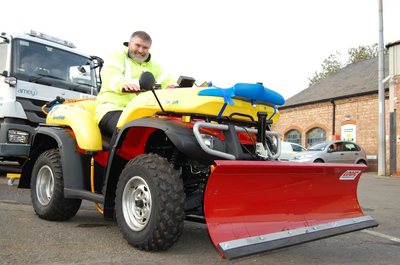 Mayor Dave Hodgson on the Quad Bike fitted with snow plough