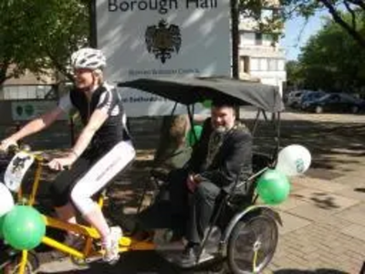 Mayor Dave Hodgson and Rebecca from Beds Road Cycling Club with Bike Week Rickshaw