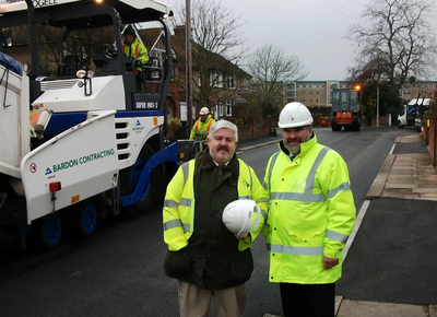 Mayor Dave Hodgson and Charlie Royden with road machine