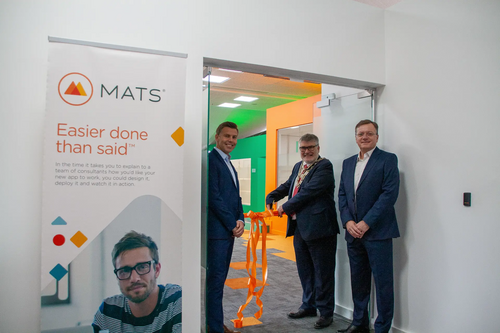 Mayor Dave Hodgson cuts the ribbon at the opening of MatsSoft's new offices at Bedford Heights