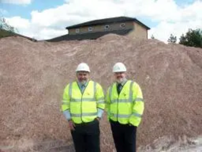 Dave Hodgson and Cllr Charles Royden with some of the Council's salt stocks