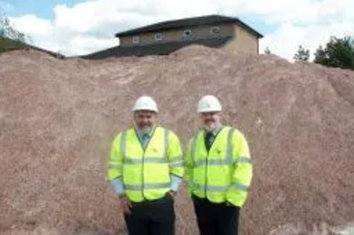 Dave Hodgson and Cllr Charles Royden with some of the Council's salt stocks