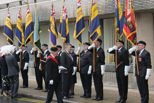 Mayor Dave Hodgson 'inspecting the standards' at the Armed Forces Day Flag Raising Ceremony at Borough Hall