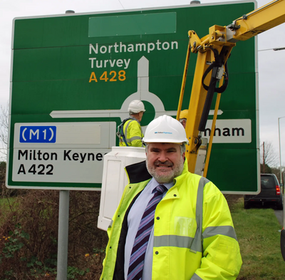 Mayor Dave Hodgson with M1 signage