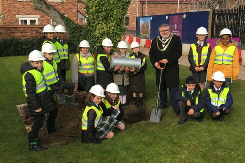 Mayor Dave at the Time Capsule burial at The Place in Kempston with children