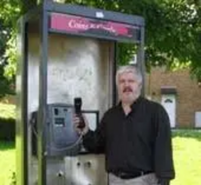 Cllr Charles Royden with Carron Road Payphone