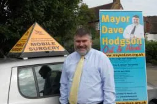 Mayor Dave Hodgson with village tour signs