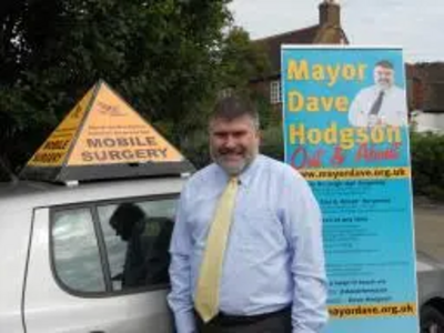 Mayor Dave Hodgson with village tour signs