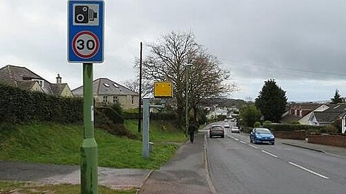 Speed camera beside residential road