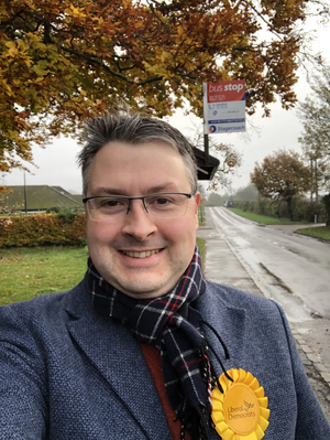 Daniel Norton at a rural bus stop in North East Bedfordshire