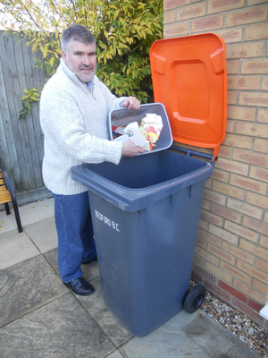 Mayor Dave Hodgson Using his Orange-Lidded Recycling Bin