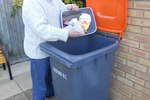 Mayor Dave Hodgson Using his Orange-Lidded Recycling Bin