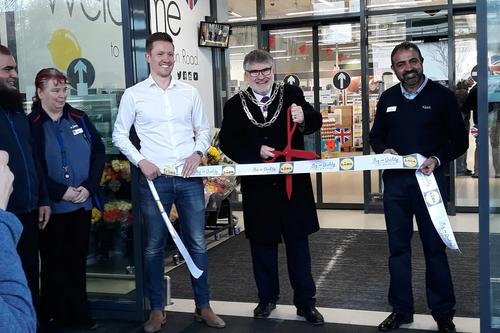 Mayor Dave Hodgson cuts the ribbon at the opening of the Lidl store on Goldington Road