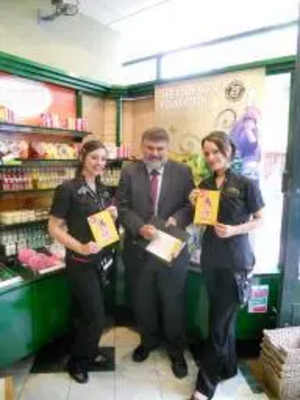 Mayor Dave Hodgson signing up to the Stop Sex Trafficking of Children Campaign in Body Shop, Bedford