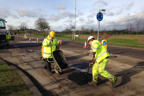 Dave Hodgson lending a hand on site during pothole repair work on Wentworth Drive in Bedford