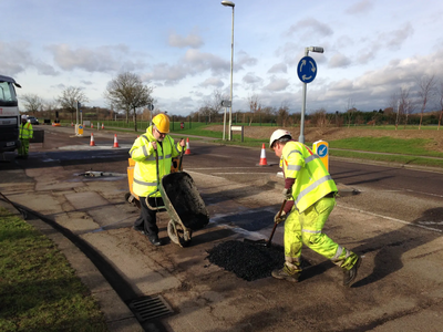 Dave Hodgson lending a hand on site during pothole repair work on Wentworth Drive in Bedford